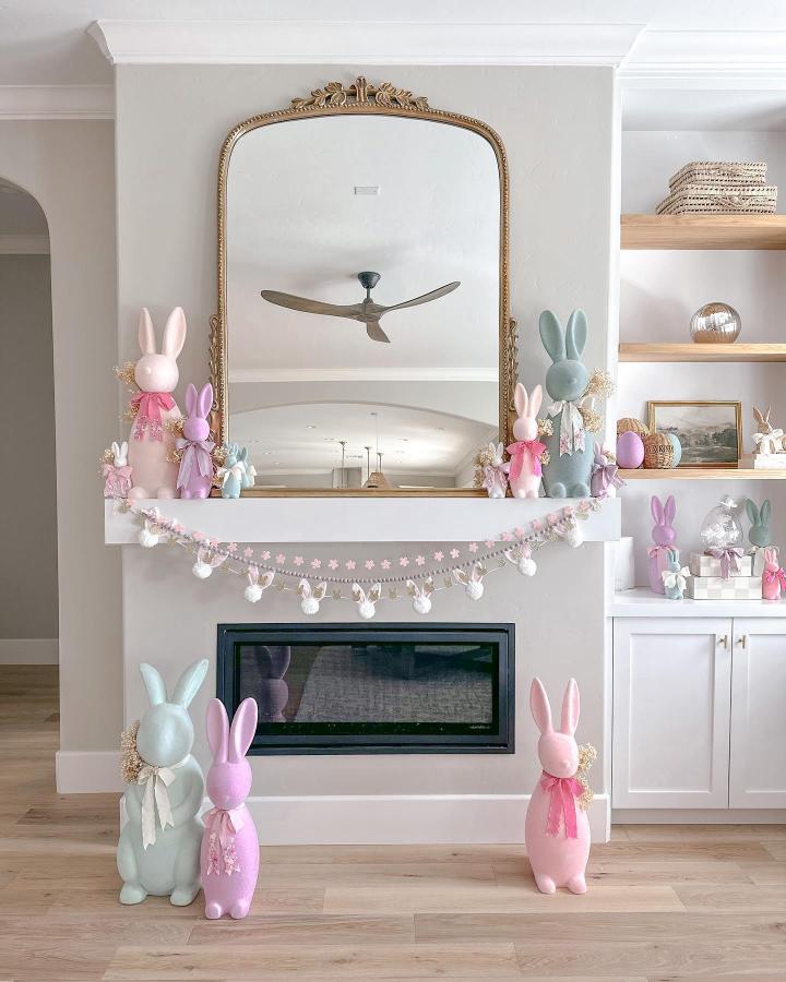 Soft pastel bunny statues and floral garland mantel decor from @aurelie.erikson perfect for easter mantel decor ideas.