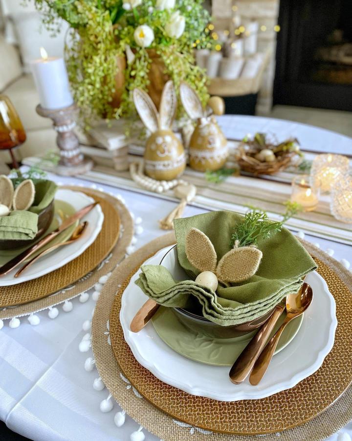 burlap bunny ear napkins and olive green table setting with copper utensils from @dining_delight stylish easter place setting ideas