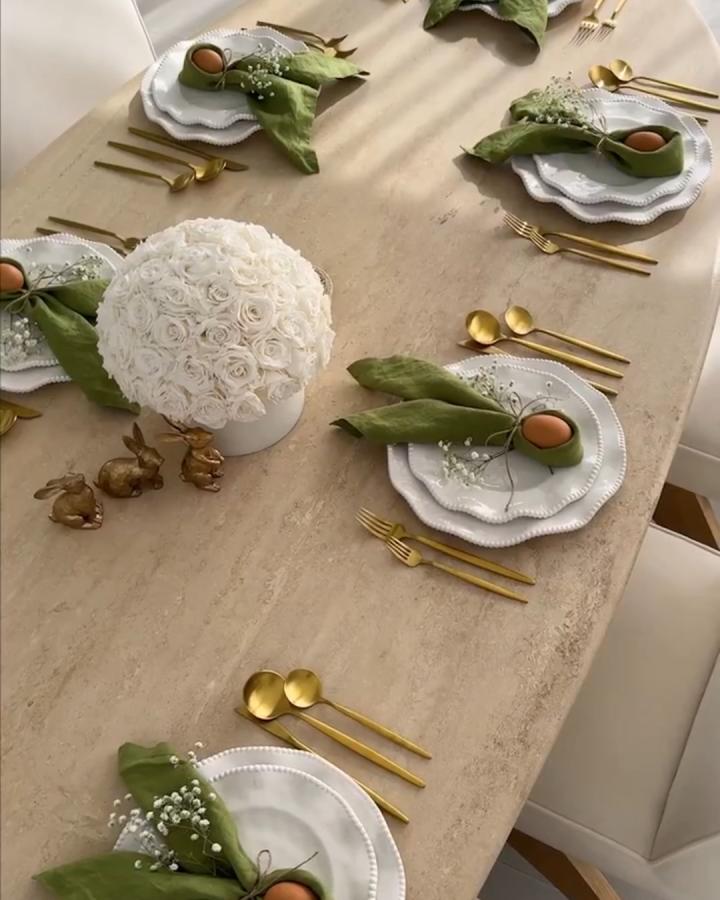Olive green napkins and natural brown eggs on white plates with gold flatware from @jessimalay easter place setting ideas.