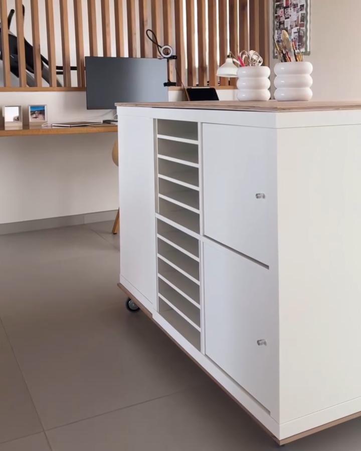 White and natural wood ikea kallax craft room ideas rolling cart with paper storage slots from @madamebblog. Sleek and mobile craft organizer.