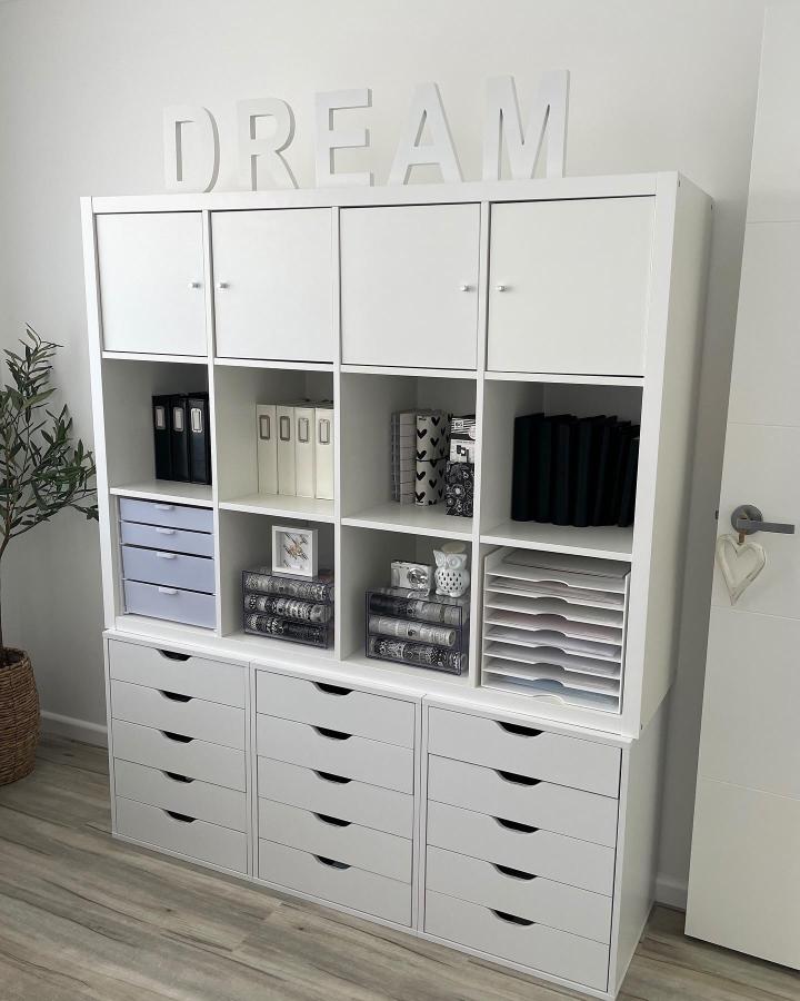 White ikea kallax craft room ideas storage unit with drawers and doors from @hannascraftroom neatly organized with craft supplies