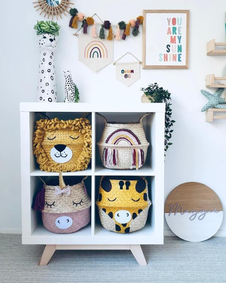 woven animal baskets kids room from @bellybambinobasket. White Kallax cubes with lion, unicorn, rainbow, and giraffe storage.