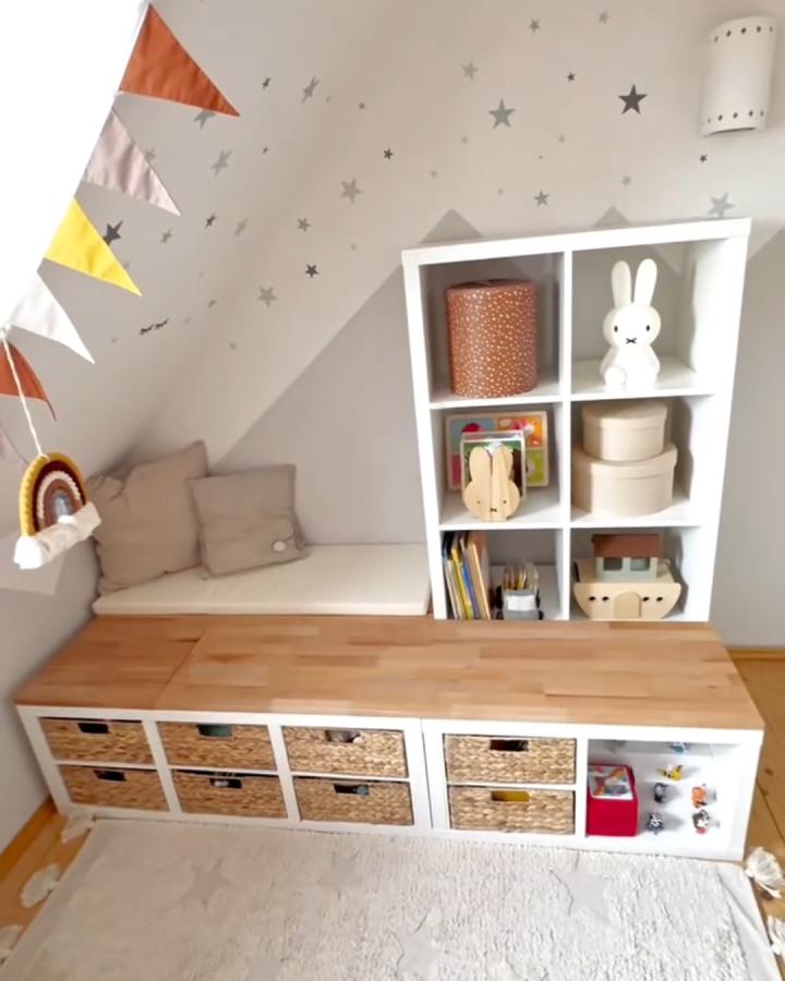 beige and white toy storage bench from @kreativbabs. wicker baskets and open cubbies for ikea kallax toy storage ideas