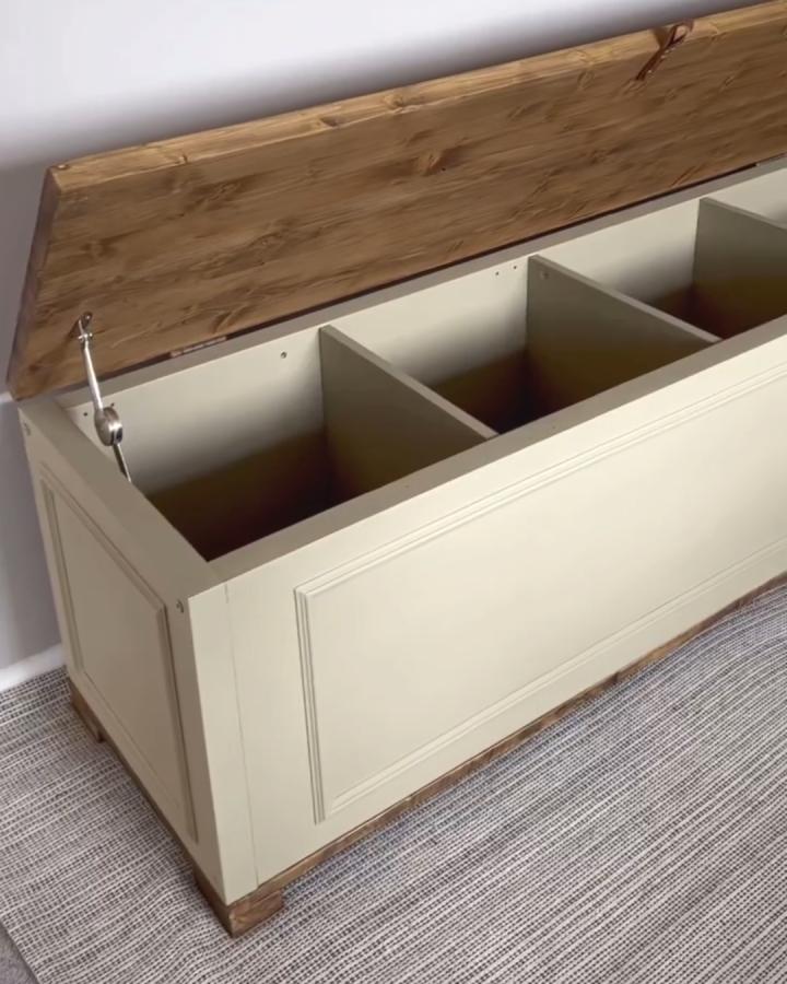 Cream and wood toy bench from @do.it.yourself.mum. Lift top Kallax storage with paneled sides.