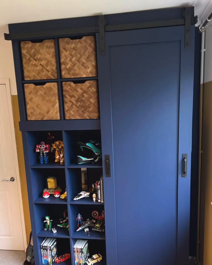 navy and woven storage wall from @do.it.yourself.mum. Sliding door and open cubbies for toys