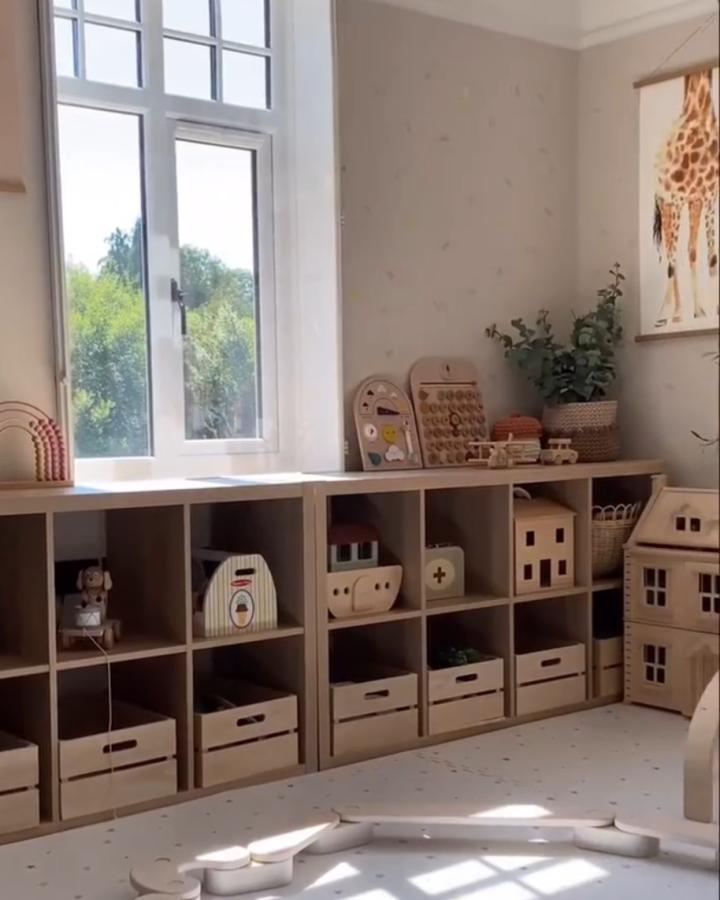 Natural wood kallax toy storage from @helenaruddstudio. Calm cubbies and crate-style bins.