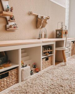 beige and oak toy storage from @itsofficialchantal. ikea kallax toy storage ideas with woven baskets and open cubbies.