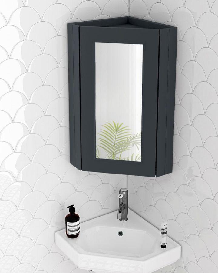 Graphite corner mirror cabinet from Victorian Plumbing in small bathroom maximizes space with sleek modern design.