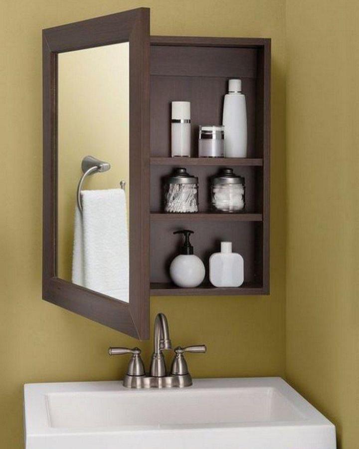 Wood-framed bathroom mirror cabinet from Construex with hidden shelving and storage for small bathrooms bathroom mirror ideas for small spaces