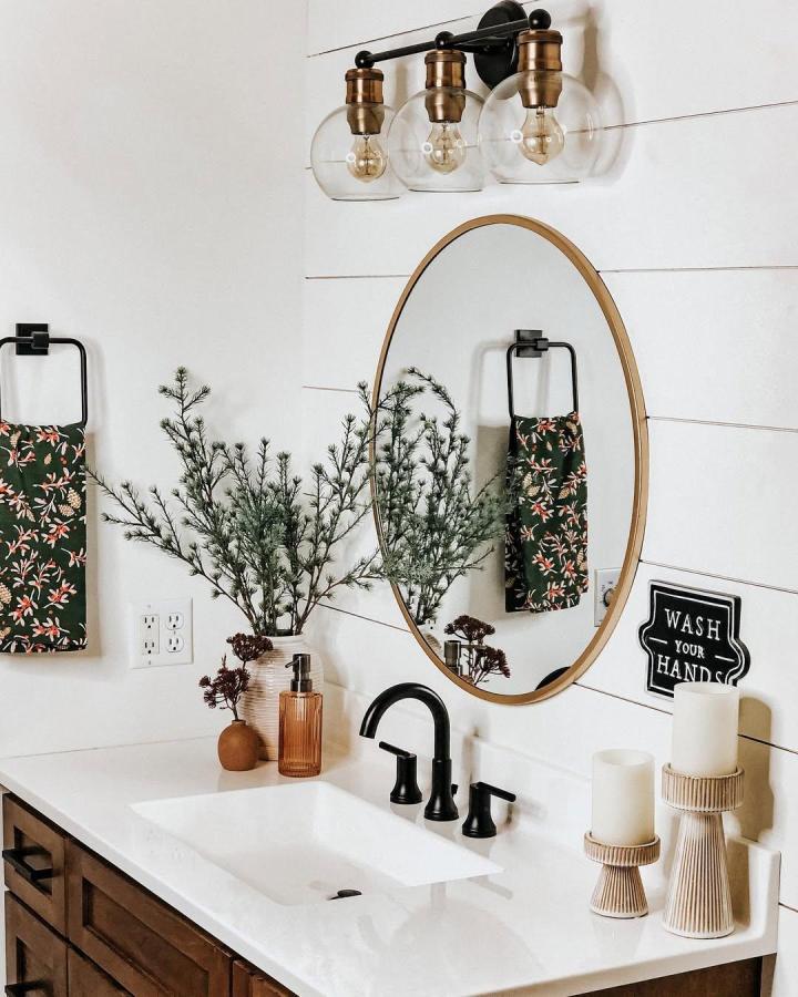 white shiplap bathroom wall panels with wooden mirror and black fixtures from @home_and_huffman bright and inviting rustic style bathroom wall panel ideas