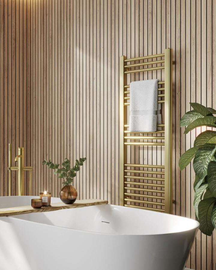 Light oak slatted wood bathroom wall panel ideas from @naturepanel_uk with brass towel rail and greenery. Natural texture and warmth.