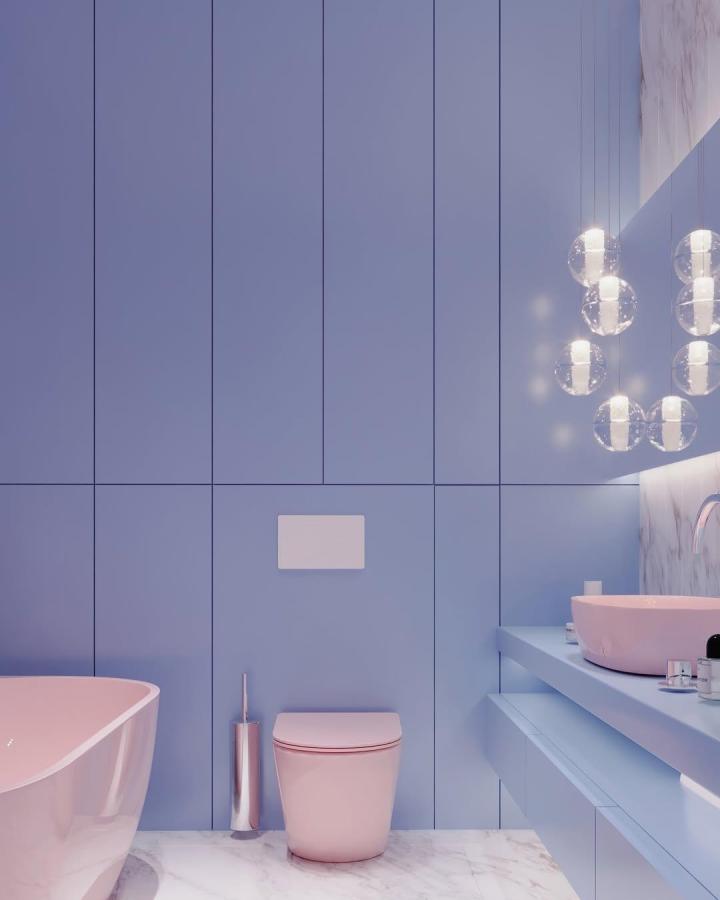 baby blue walls and blush pink fixtures in a minimalist bathroom by @octopus_interior showcasing blue bathroom decor ideas with marble flooring and glass pendant lights