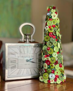 Green and red button craft tree next to vintage silver clock from my100yearoldhome. Handmade festive décor with mixed buttons and pearl pins.