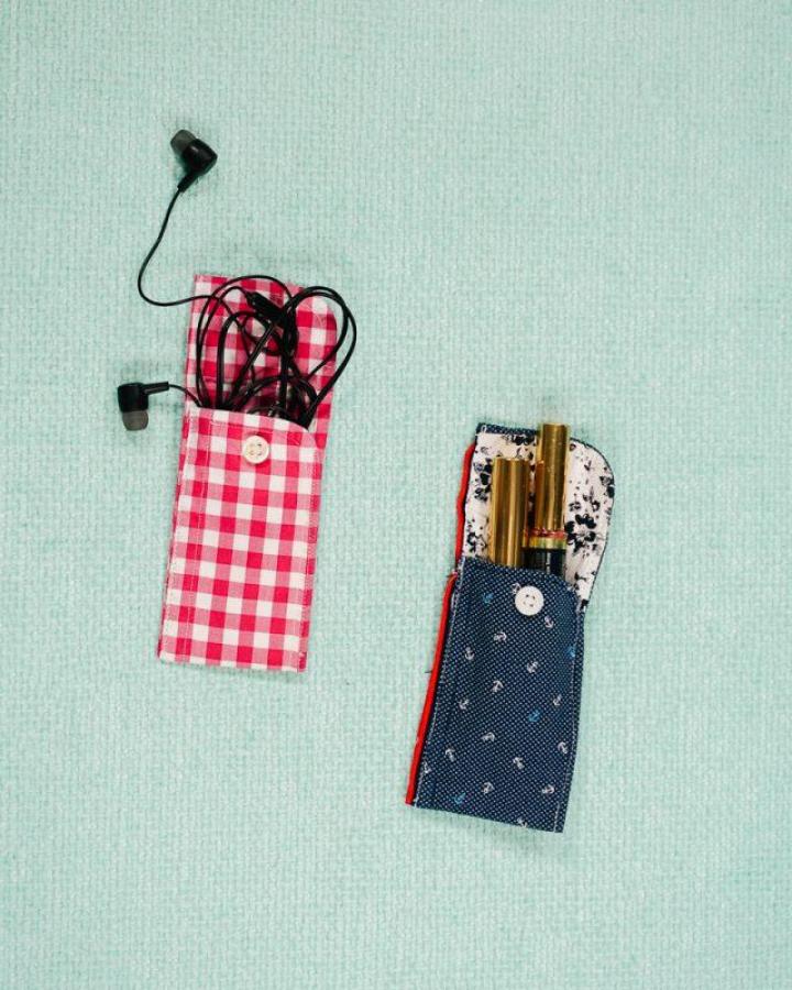 Red and blue fabric button closure pouches for button crafts for adults from heatherhandmade. Small handmade organization sleeves with vintage buttons.