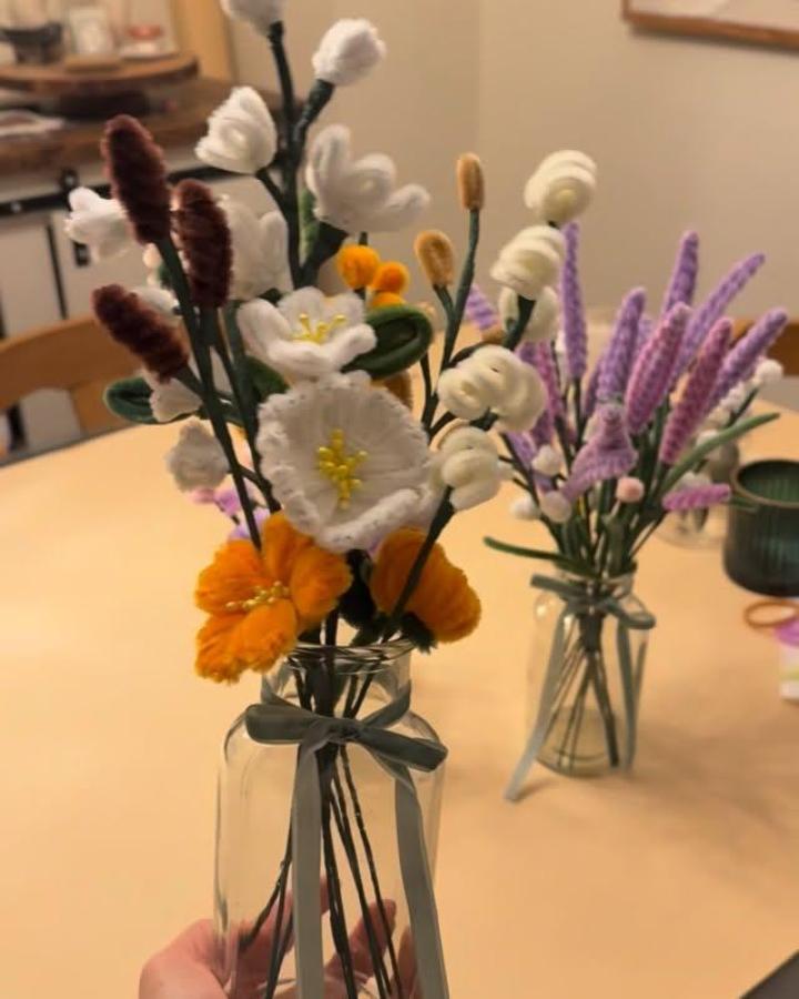 Felt flower bouquet in glass jar from @misonani featuring soft textures and bright colors for craft night themes for adults. Handcrafted floral decor.