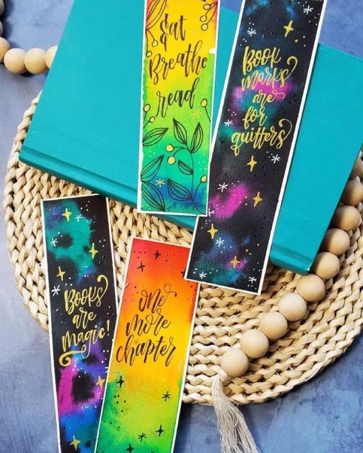 Watercolor and metallic bookmarks from Doodle Craft with colorful cosmic and gradient designs for craft night themes for adults.