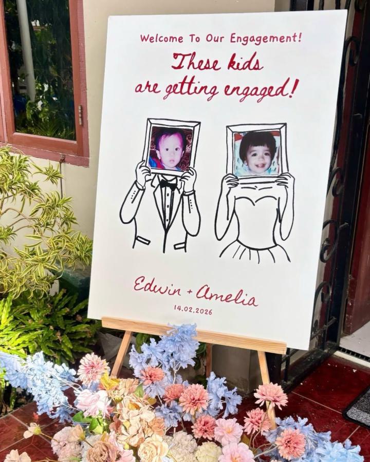 Playful red hand-lettered welcome sign with childhood photo frames and pastel florals from @aksarasign for diy wedding welcome sign ideas.
