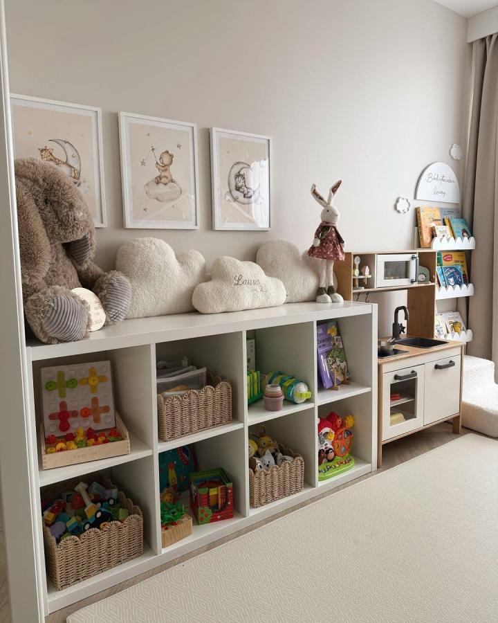 White ikea kallax bookshelf with woven baskets and plush cloud cushions from @nataliaxlaurka in cozy kids playroom setting