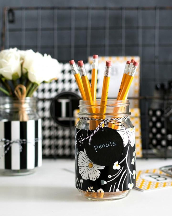 Black floral patterned mason jar pencil holder by It All Started With A Paint brightens workspace with cheerful design and twine tag labeled pencils