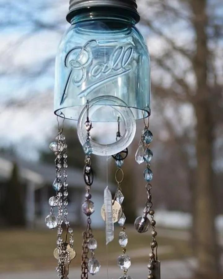 Blue vintage Ball mason jar wind chime with beaded chains and charms from Saved by Love. Outdoor craft with sparkling accents.