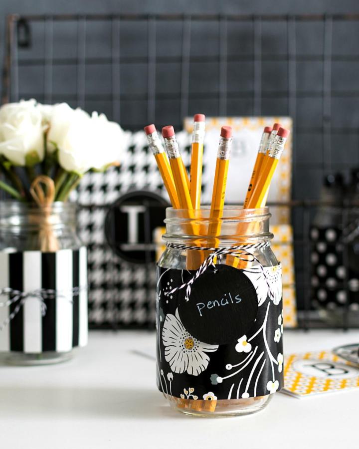 Black and white floral patterned mason jar desk organizer from itallstartedwithpaint holding yellow pencils for mindful crafts for beginners.