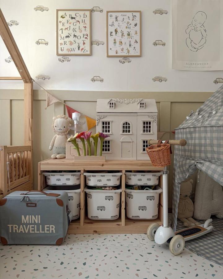 grey and natural wood toy storage with printed bins ikea nursery storage ideas from @iga_luk playful and organized nursery corner with scooter and dollhouse storage bins
