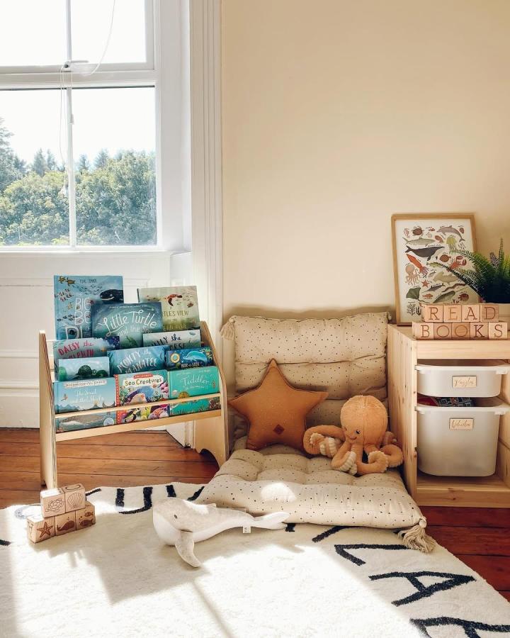 Natural pine reading nook with cushioned seating and wooden storage from @lifeatolddenehouse. ikea nursery storage ideas. Simple, warm, and inviting corner.