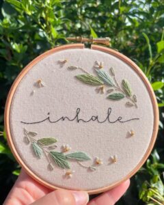 green and cream embroidered hoop art with floral details from @mortimermakes mindful crafts for beginners peaceful hand stitching project