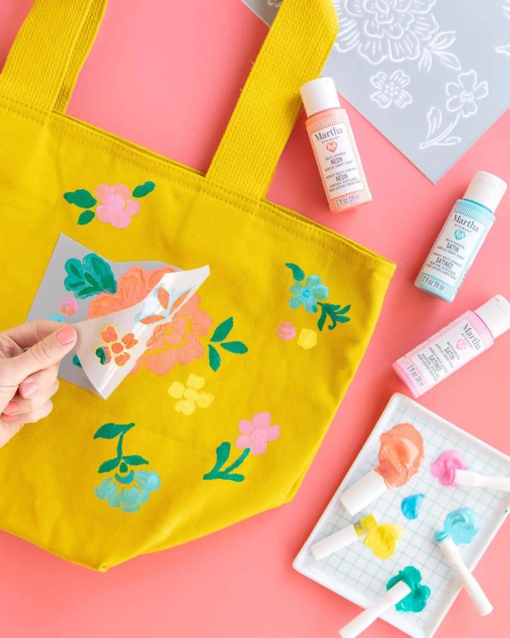 mustard yellow canvas tote with pastel floral stencil painting and acrylic paints from sarahhearts mindful crafts for beginners colorful and charming craft project
