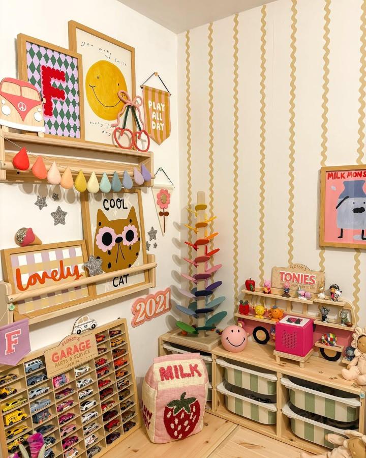 [light wood and pastel striped nursery storage bins and shelves from @ohsomum_ ikea nursery storage ideas playful and organized]