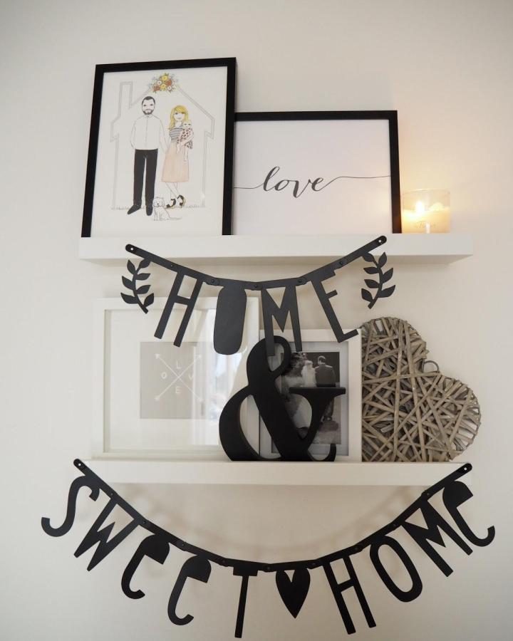 black paper home sweet home banner on white shelves from dovecottageblog simple mindful crafts for beginners with cozy vibe and decor elements