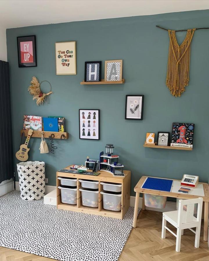 natural pine ikea nursery storage ideas with clear bins and teal walls by @the_never_ending_jobs_list tidy and playful kids corner