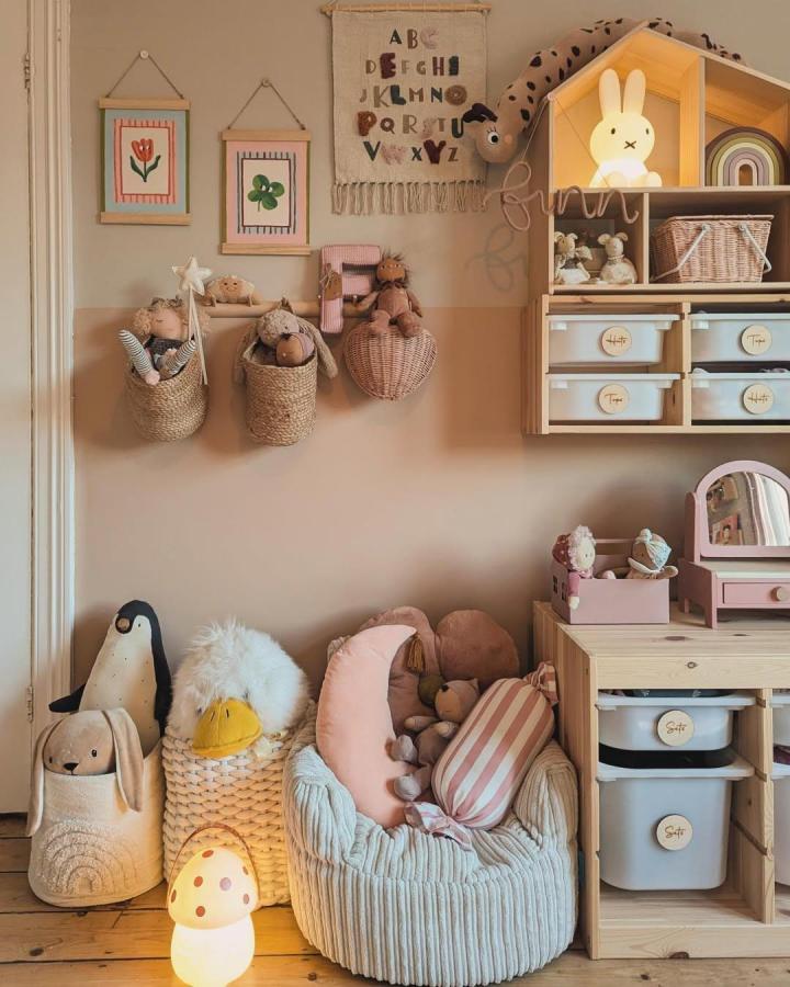 [earthy natural textures ikea nursery storage ideas from @reno_on_the_park with woven baskets and wooden shelving]
