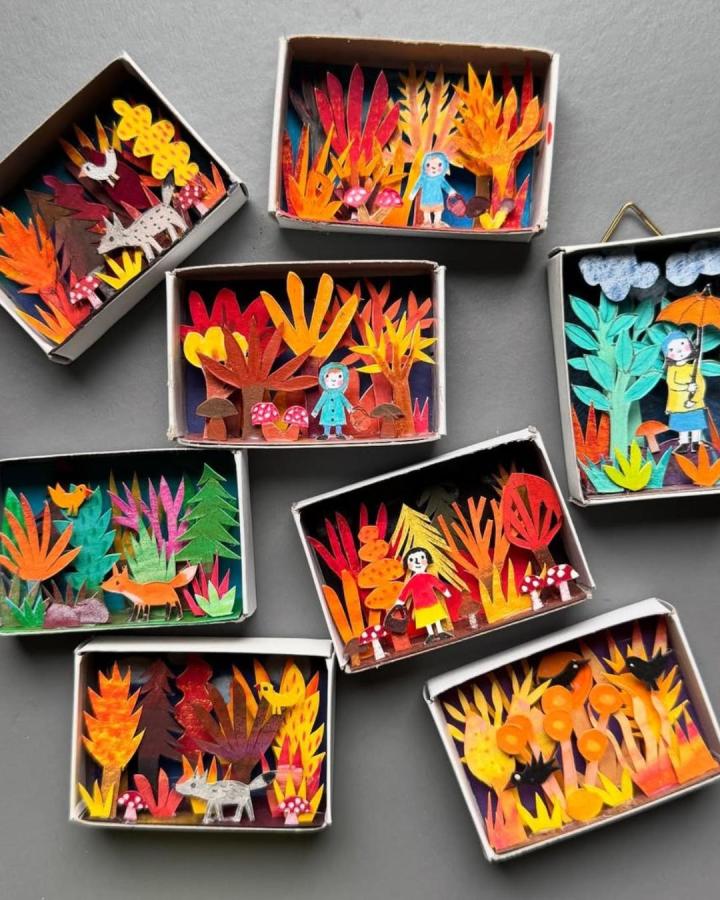 Fiery orange and red paper matchbox dioramas from @antje.damm showing detailed miniature paper crafts for adults in forest scenes.