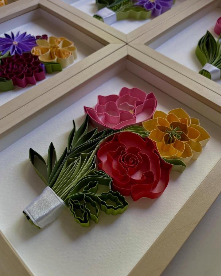 Framed colorful floral paper quilling bouquet with satin ribbon from @adriennkg_paperart showcasing paper crafts for adults delicate rolled petals.
