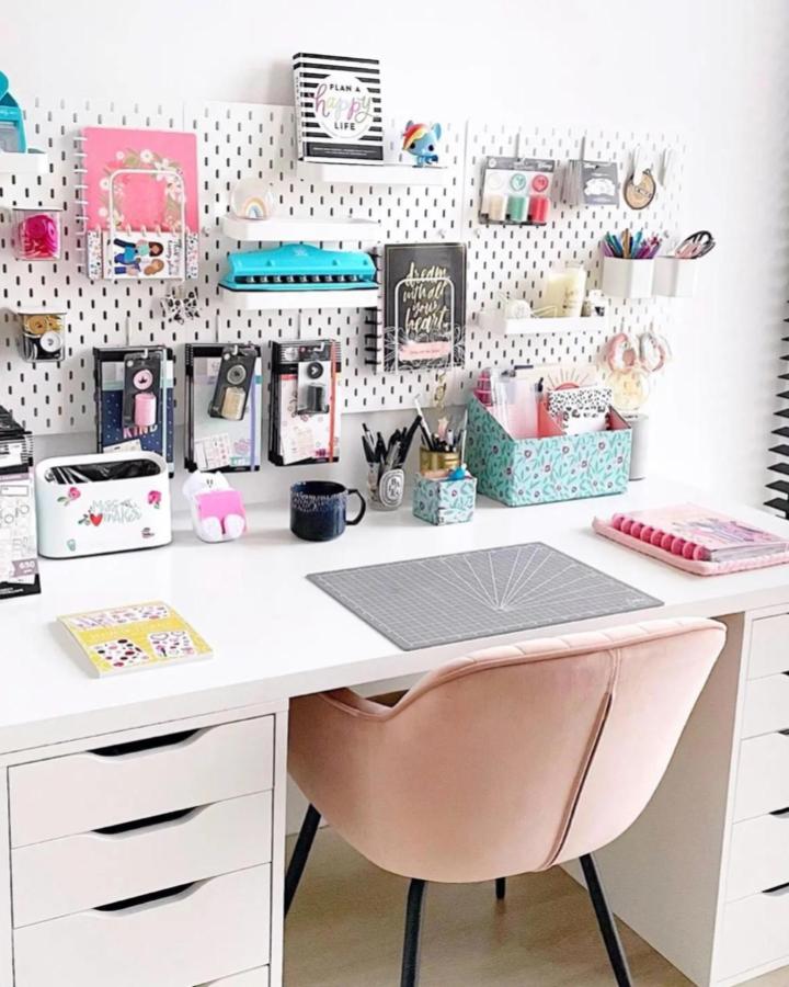 white ikea skadis craft room ideas workspace with pastel storage and blush chair from @happy_planner_cindy bright and organized craft desk setup