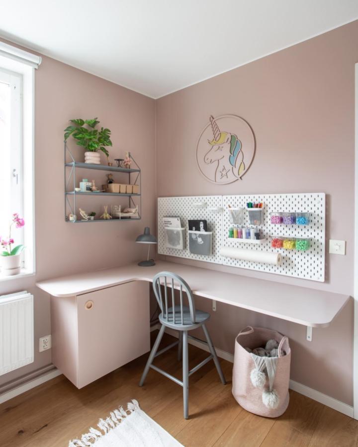 pink and grey ikea skadis craft room ideas corner with pegboard and pastel accessories from @designbycilla bright and tidy workspace