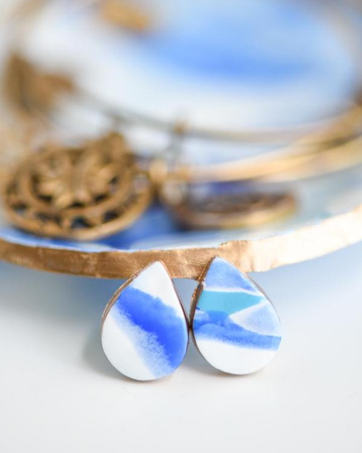 Blue and white marbled teardrop earrings with gold edges handmade from polymer clay by a pumpkin and a princess bright and elegant accessory