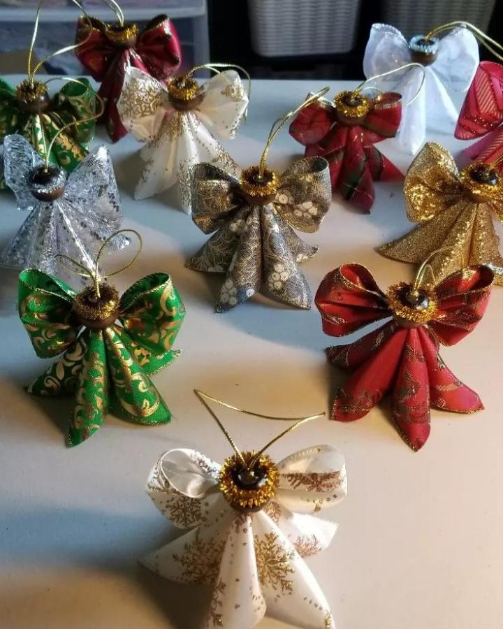 Green, red, gold, silver, and white holiday ribbon angel ornaments with beads and pipe cleaners from @tufaleicreations. Handmade festive decorations with glitter details.
