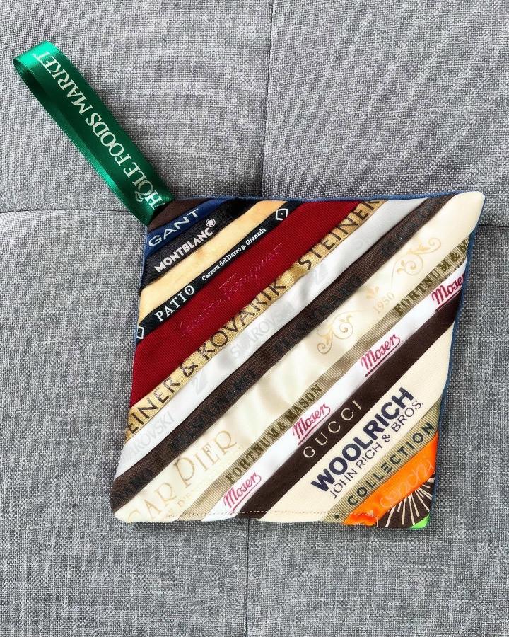 Green, brown, red, cream diagonal ribbon strip potholder for ribbon crafts for adults by @emimilly15. Vintage brand names in a patchwork design.