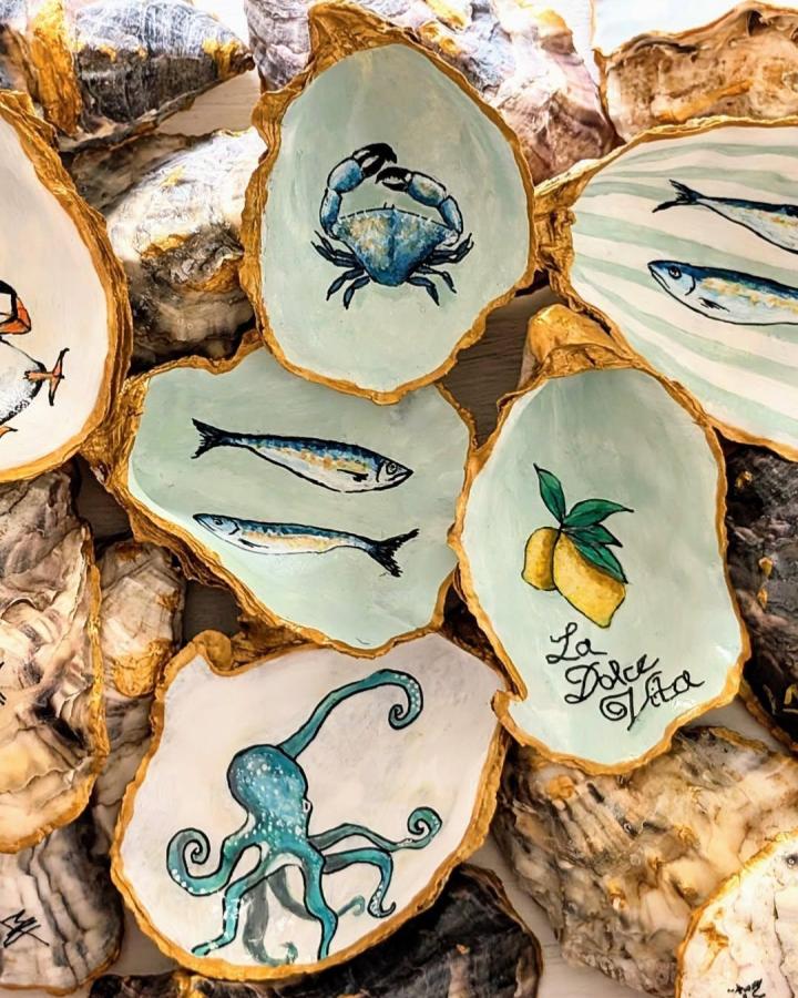 Hand-painted oyster shells with coastal creatures and lemons by @peach_melbas featuring summer coastal craft vibes.