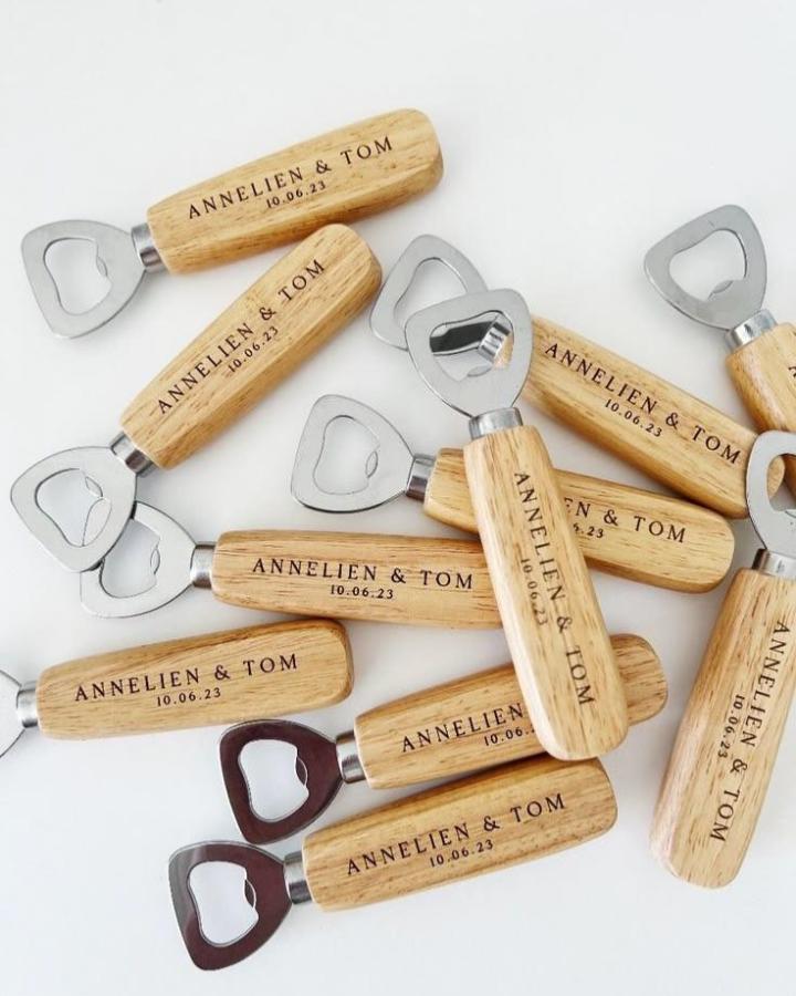 Natural wooden and metal personalized bottle openers from @yourweddingstop.fiji perfect for wedding favor ideas. Rustic and practical gifts.