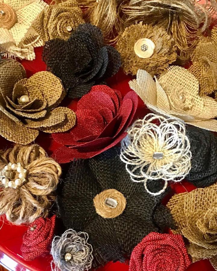 Rustic burlap flower ideas from @cheribushong feature layered textures with beads and natural earthy colors perfect for crafts.