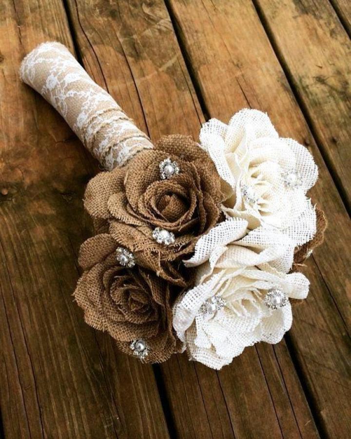 Natural burlap and lace flower bouquet with rhinestone centers from @toko.illustration showcasing rustic burlap flower ideas.