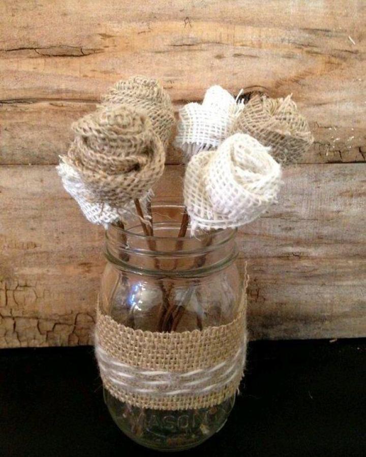 Natural beige and white burlap flower bouquet in mason jar from @emma_craftgallery showing charming rustic burlap flower ideas.