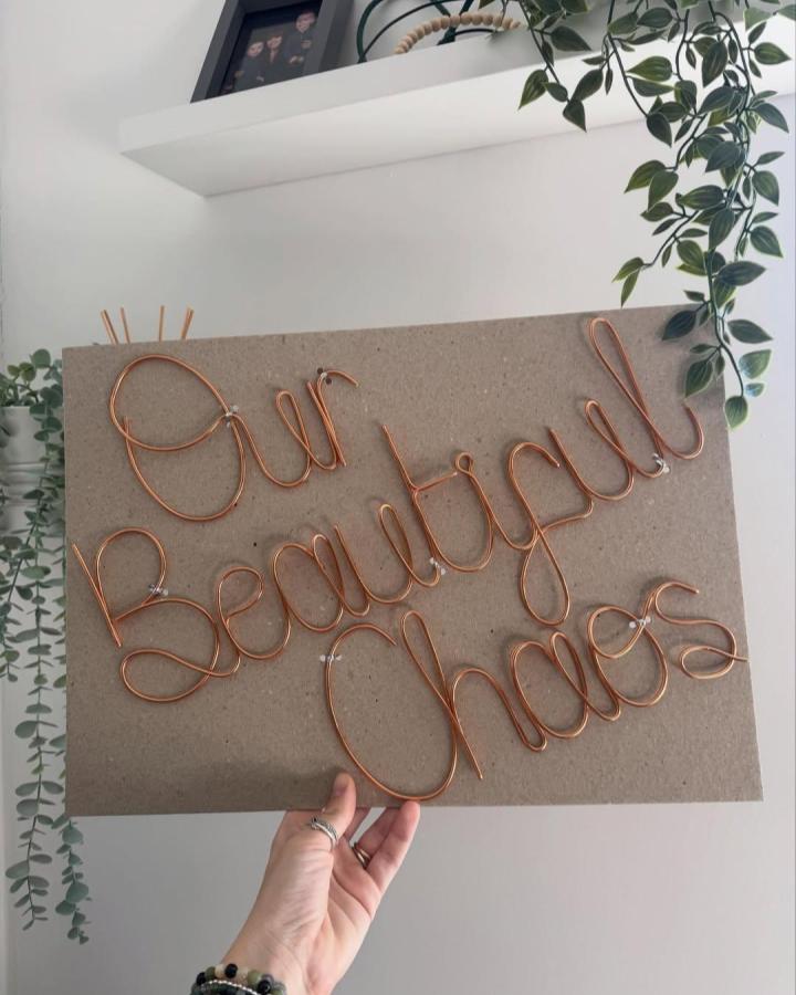 Copper wire crafts handwritten words on board by @the_wired_mummy featuring elegant, warm copper wire lettering.
