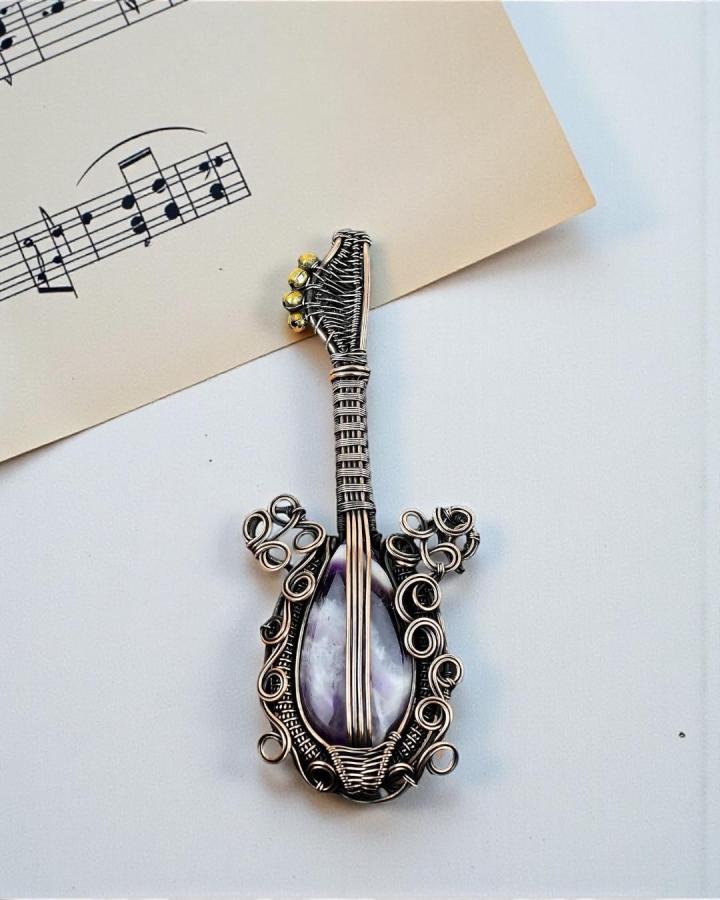 Copper and amethyst wire wrapped guitar pendant with golden bead details by @jewelrybyanaika delicate handcrafted jewelry piece.