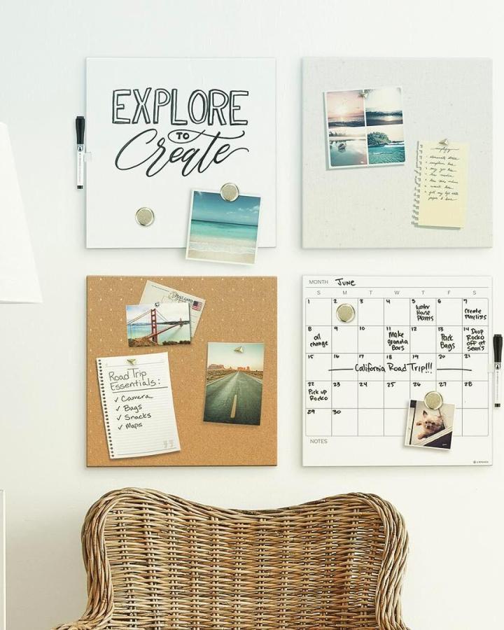 Natural cork and white minimal wall board set from @thecontainerstore showing organization and creative notes above rattan chair.