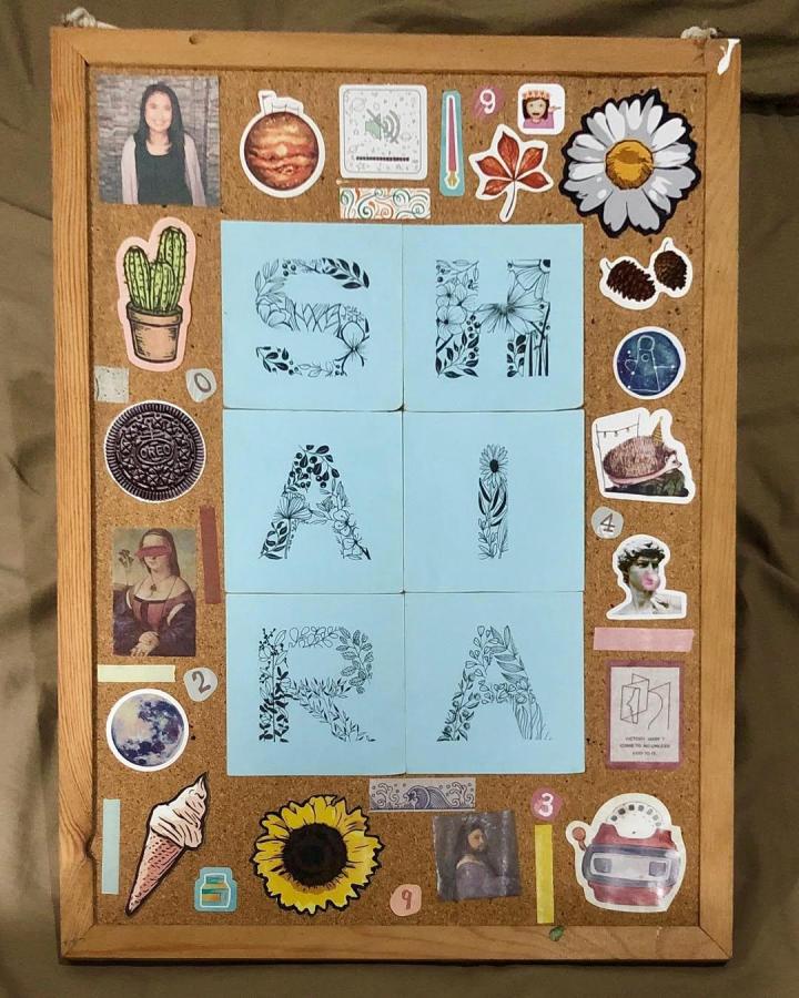 Sticker-decorated cork board wall organizer by @hi.shai featuring botanical letter notes and colorful stickers for cork board diy ideas.