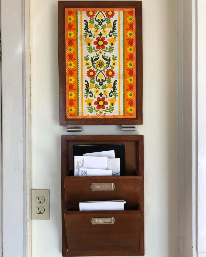 Bright floral cork board makeover and wooden mail organizer by @scans_like_a_girl adding charm to home organization.